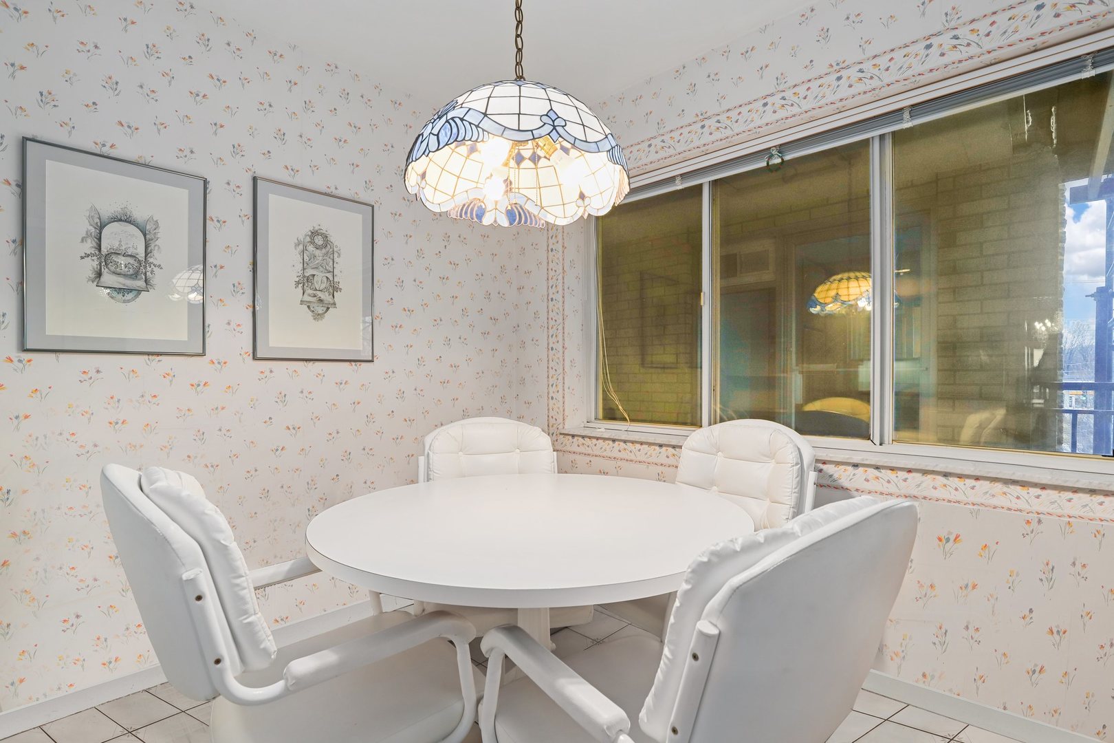 1 North Dee Road, Unit 2D Park Ridge, IL 60068 - Photo 19 of 38 a view of a dining room with furniture wooden floor and a chandelier