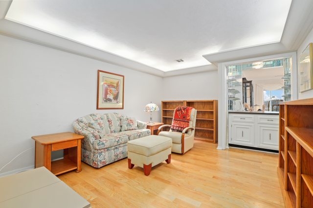 1 North Dee Road, Unit 2D Park Ridge, IL 60068 - Photo 20 of 38 a living room with furniture a flat screen tv and a table