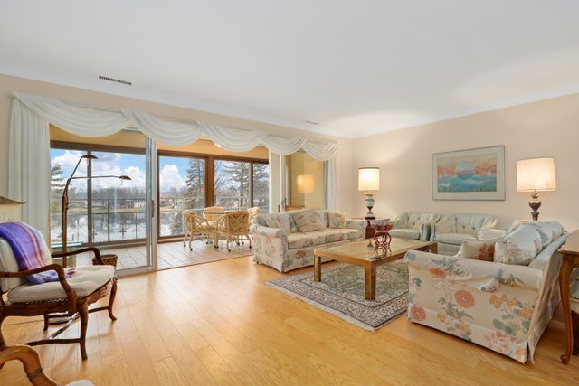 1 North Dee Road, Unit 2D Park Ridge, IL 60068 - Photo 2 of 38 a living room with furniture and a large window