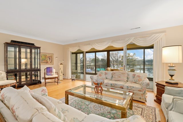 1 North Dee Road, Unit 2D Park Ridge, IL 60068 - Photo 3 of 38 a living room with furniture and a large window