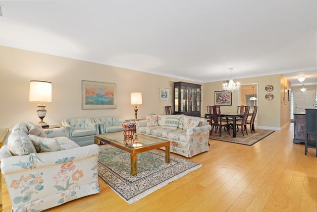 1 North Dee Road, Unit 2D Park Ridge, IL 60068 - Photo 4 of 38 a living room with furniture and a table with wooden floor