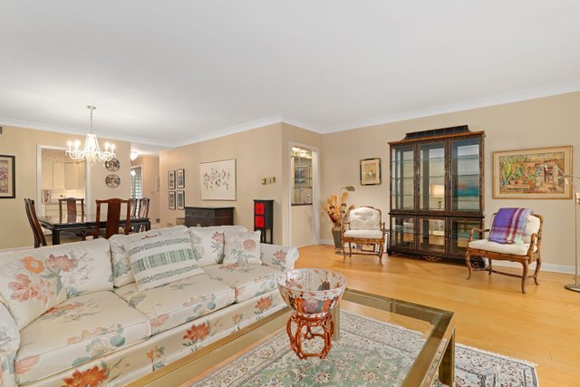 1 North Dee Road, Unit 2D Park Ridge, IL 60068 - Photo 6 of 38 a living room with furniture and wooden floor