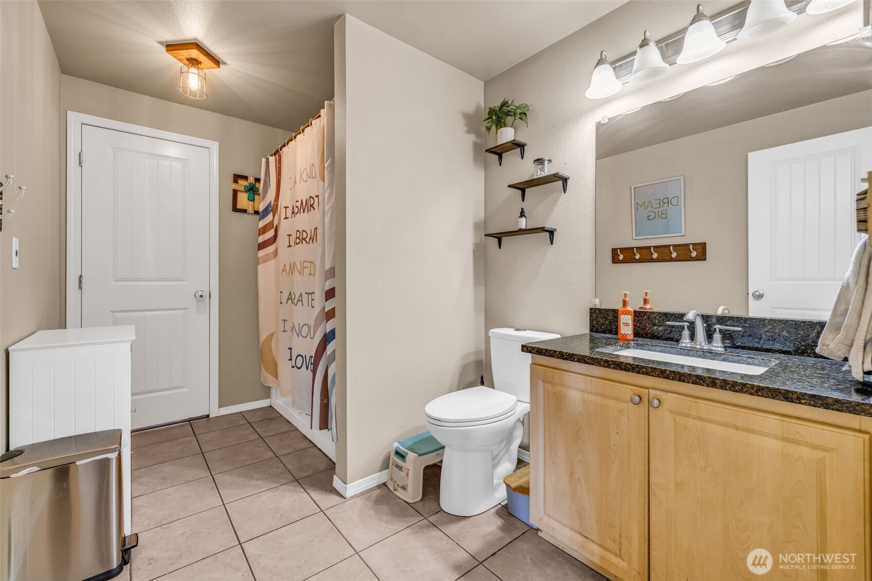 10313 School Land Road Southwest Rochester, WA 98579 - Photo 16 of 40 a bathroom with a sink toilet and shower
