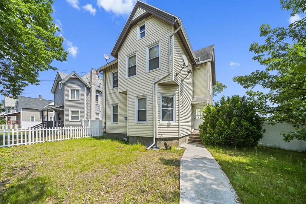 3 Cleveland Street Springfield, MA 01104 - Photo 1 of 14 a front view of a house with a garden