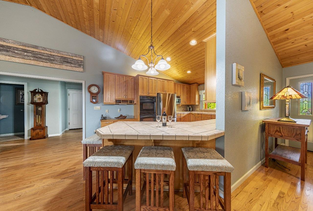 53312 Timberview Road North Fork, CA 93643 - Photo 18 of 84 a dining room with furniture and wooden floor