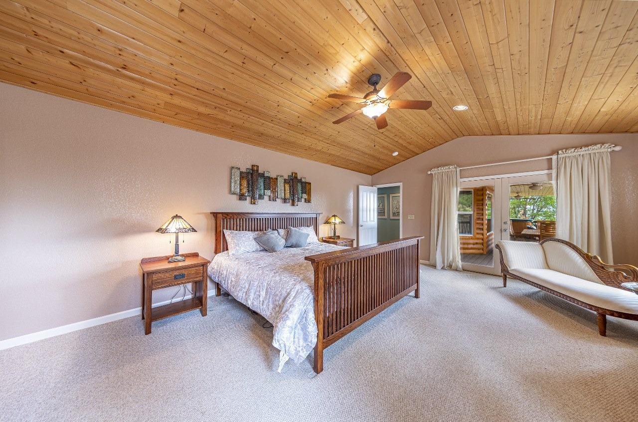 53312 Timberview Road North Fork, CA 93643 - Photo 35 of 84 a room with a bed and a chandelier