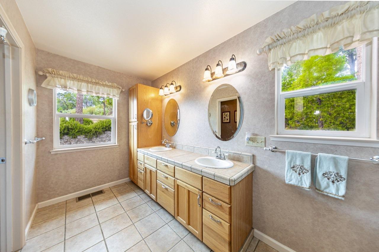 53312 Timberview Road North Fork, CA 93643 - Photo 43 of 84 a bathroom with a sink a vanity and a mirror