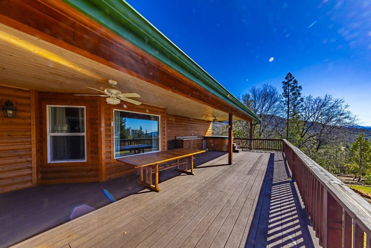 53312 Timberview Road North Fork, CA 93643 - Photo 53 of 84 a balcony with hardwood filled with table and chairs