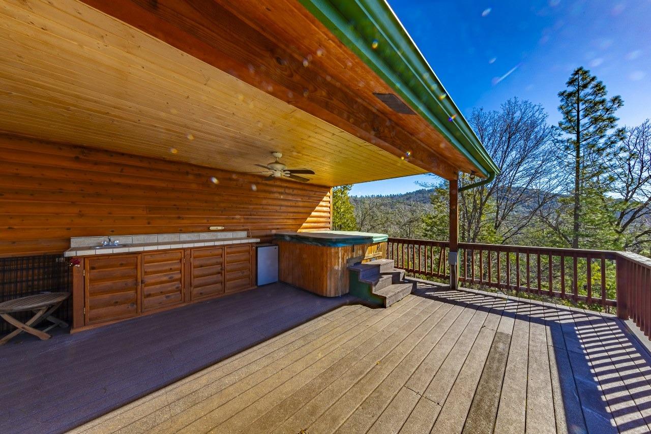 53312 Timberview Road North Fork, CA 93643 - Photo 54 of 84 a view of a balcony with wooden floor and outdoor seating