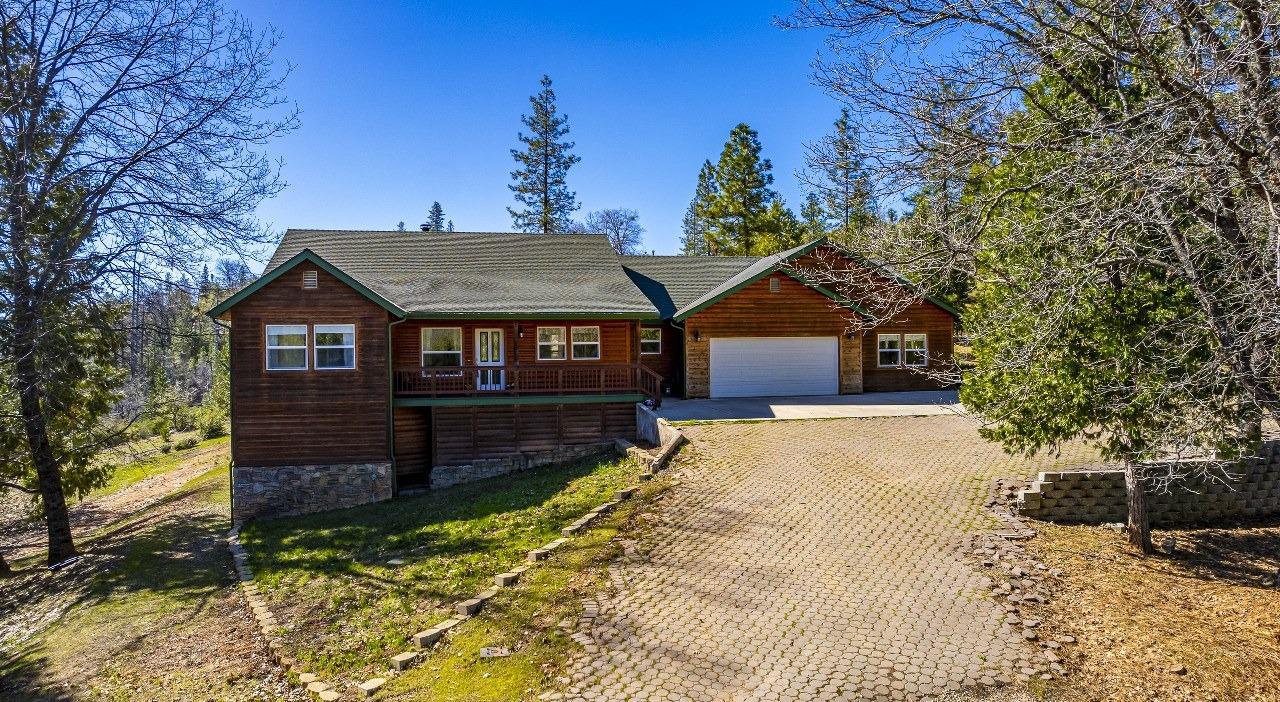 53312 Timberview Road North Fork, CA 93643 - Photo 75 of 84 a front view of a house with a yard covered in snow
