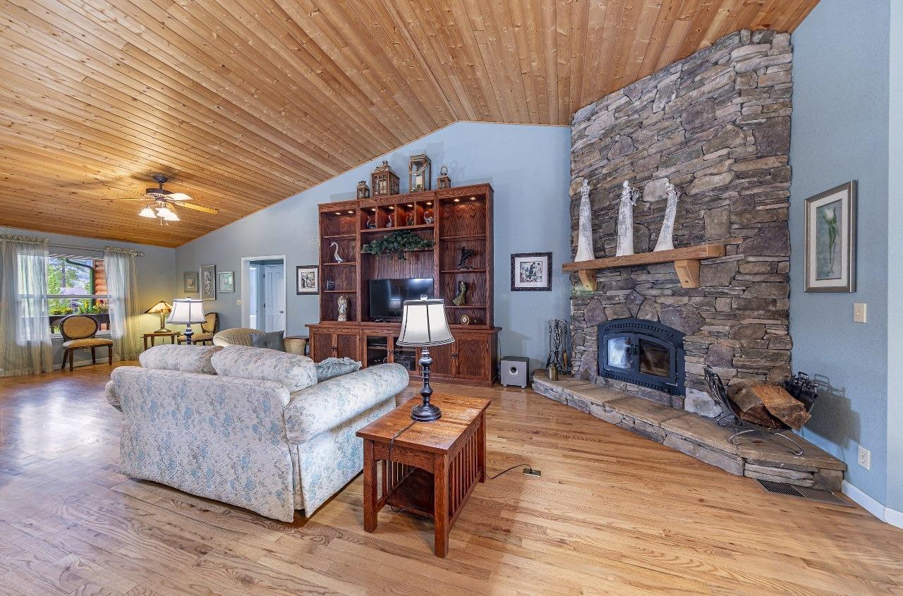 53312 Timberview Road North Fork, CA 93643 - Photo 8 of 84 a living room with furniture a fireplace and a table