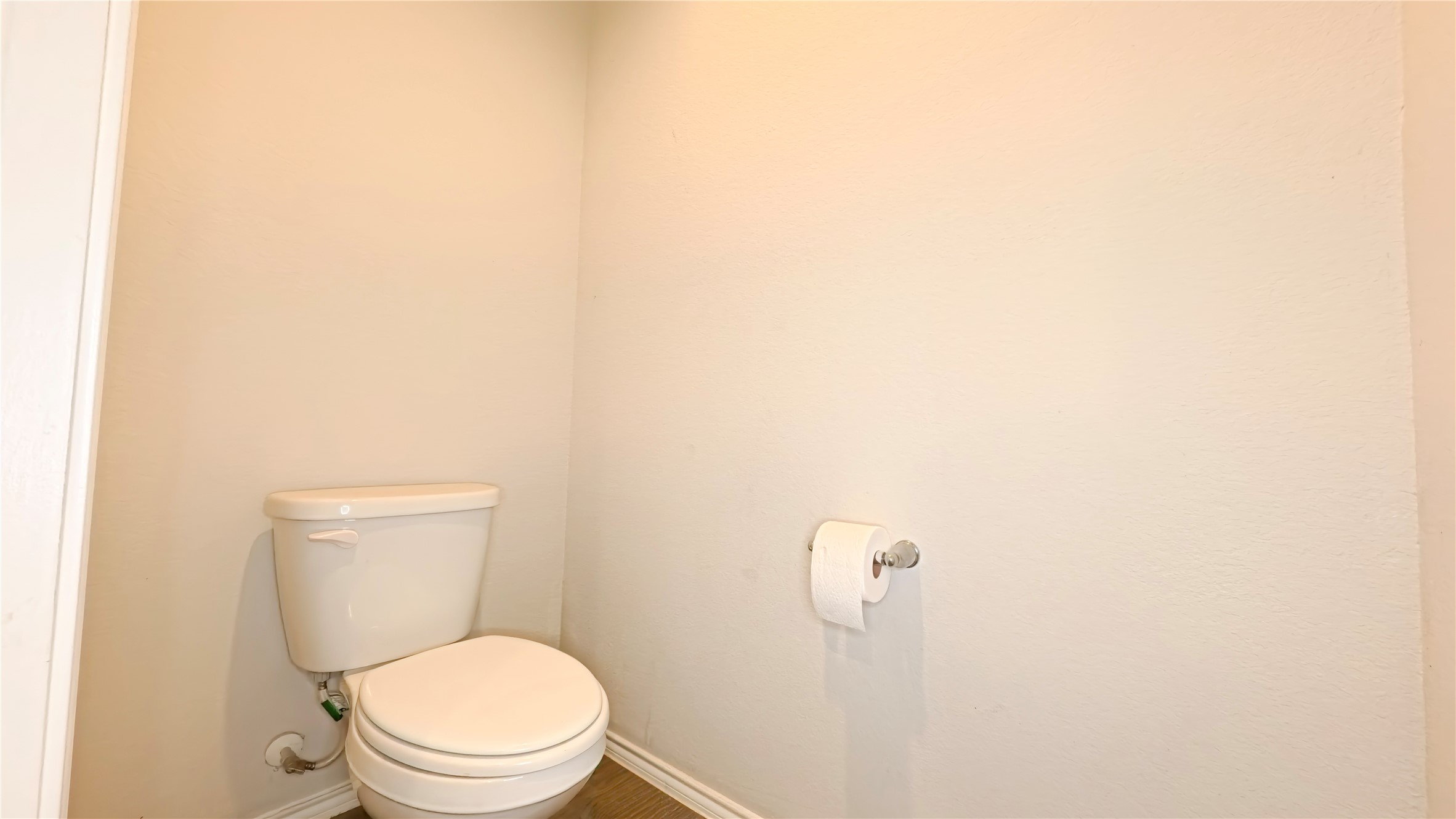 8522 Sacred Lotus Lane Rosharon, TX 77583 - Photo 11 of 11 a white toilet sitting next to a white wall