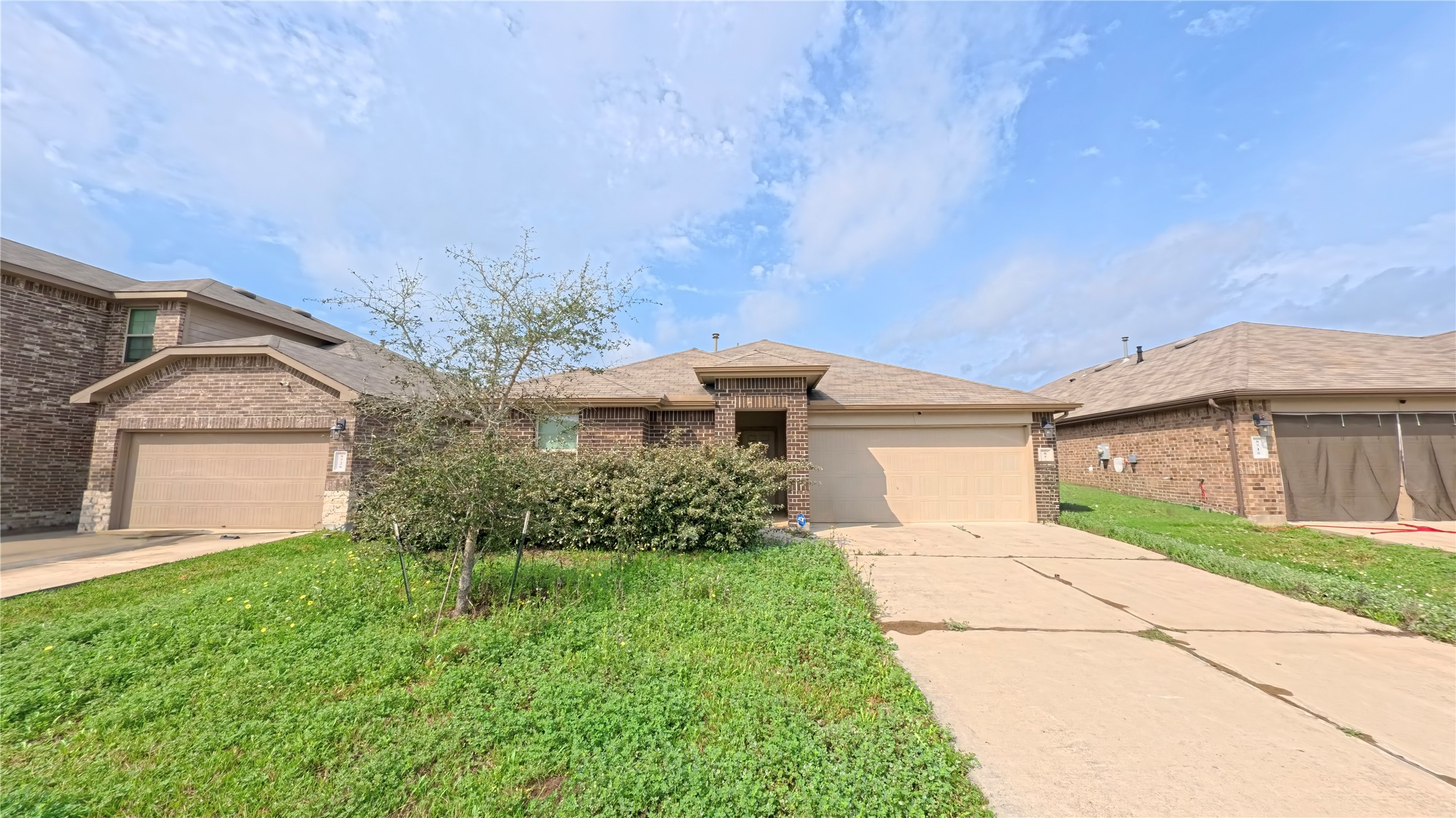 8522 Sacred Lotus Lane Rosharon, TX 77583 - Photo 2 of 11 front view of house with a yard