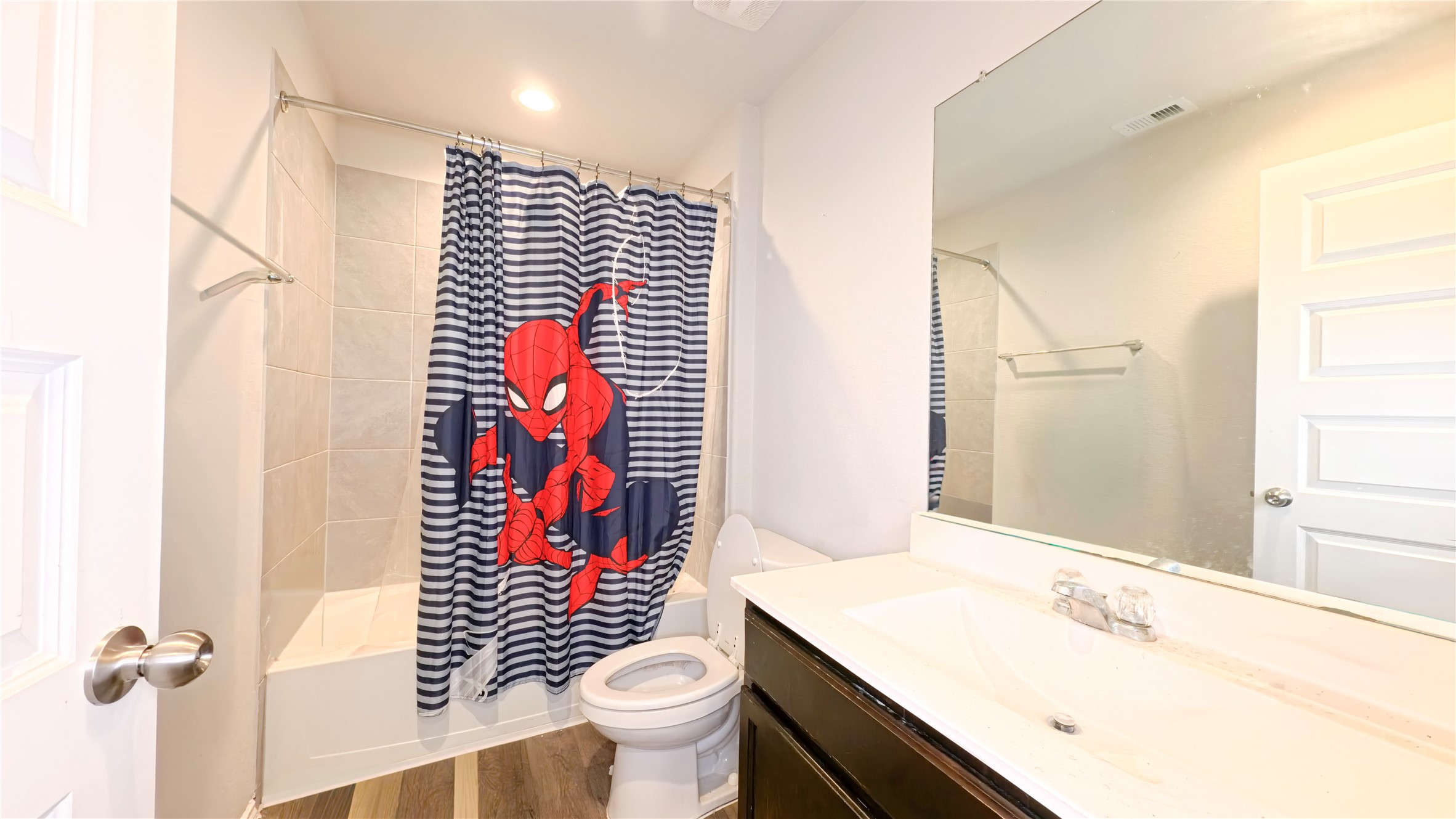 8522 Sacred Lotus Lane Rosharon, TX 77583 - Photo 9 of 11 a bathroom with a sink a toilet and shower