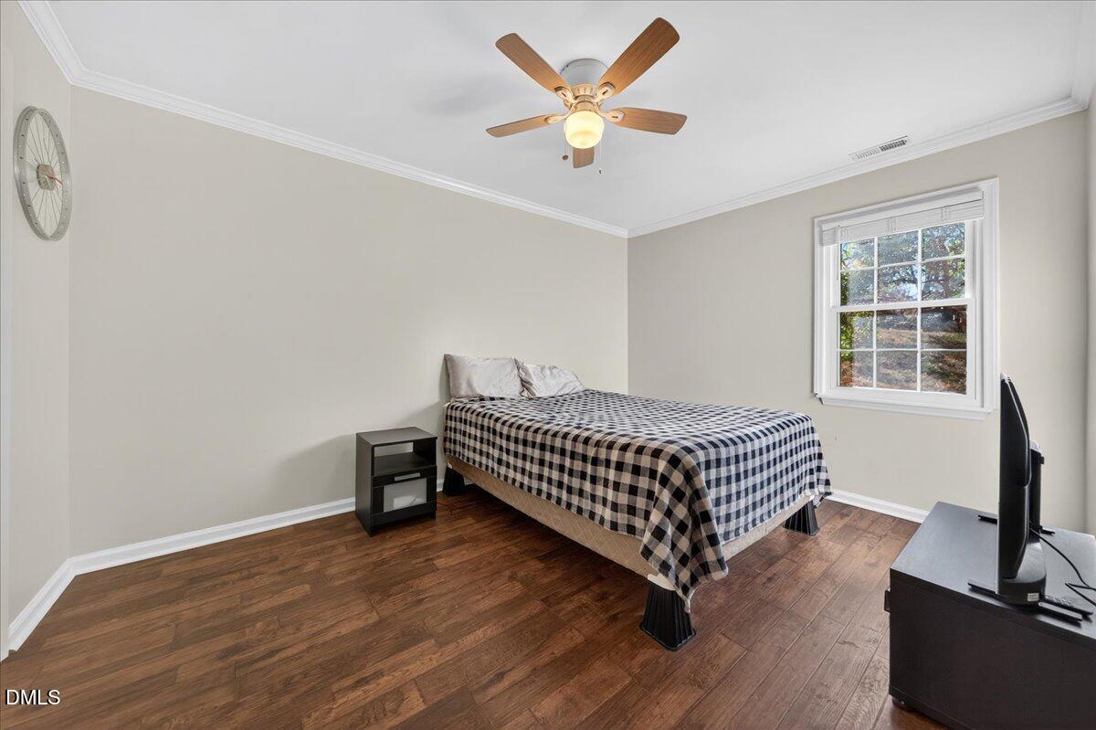 503 Gooseneck Drive, Unit A1 Cary, NC 27513 - Photo 13 of 37 a bedroom with a bed and a window