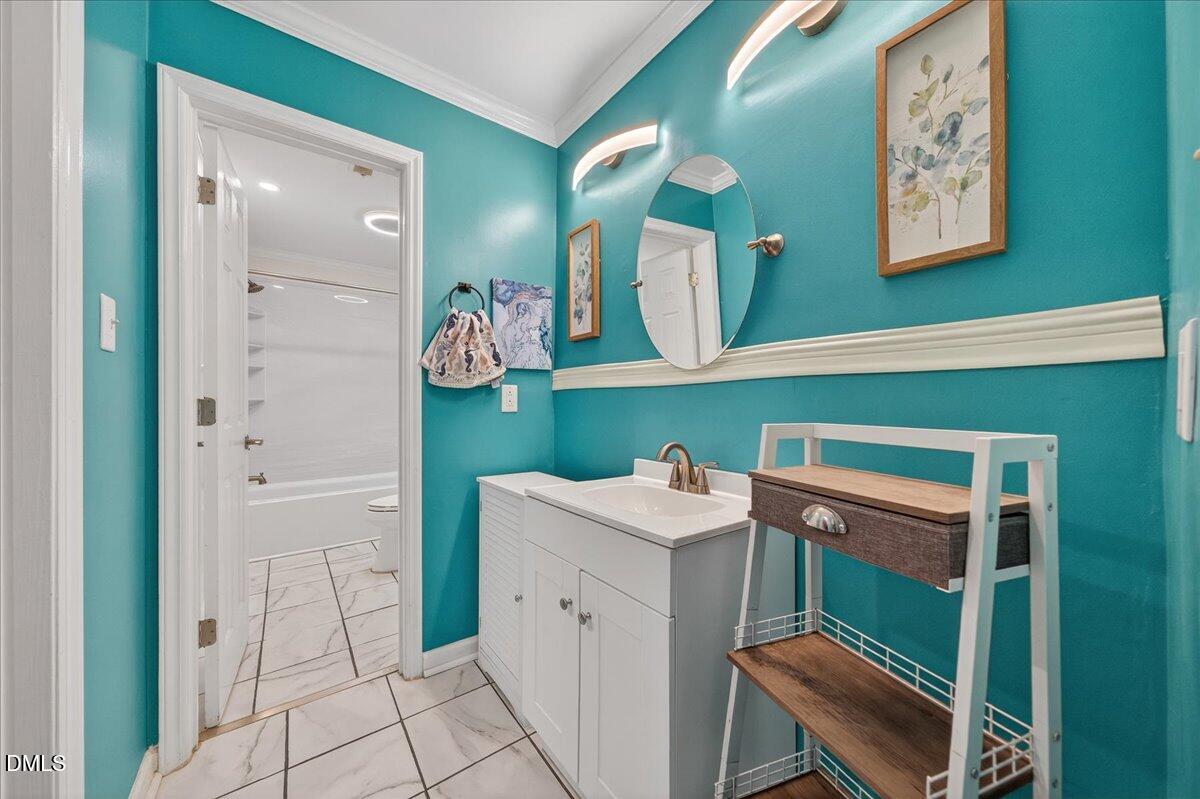 503 Gooseneck Drive, Unit A1 Cary, NC 27513 - Photo 16 of 37 a view of a kitchen with fridge and wooden floor