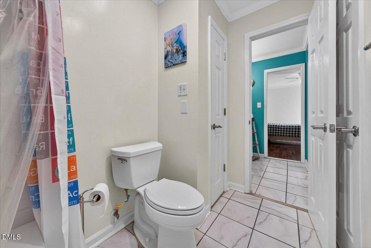 503 Gooseneck Drive, Unit A1 Cary, NC 27513 - Photo 20 of 37 a white toilet sitting next to a bathroom sink