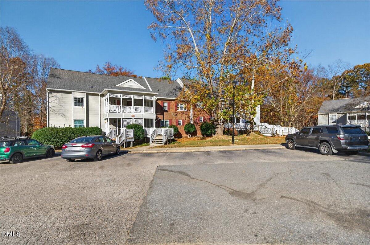 503 Gooseneck Drive, Unit A1 Cary, NC 27513 - Photo 2 of 37 a view of a cars parked in front of a building