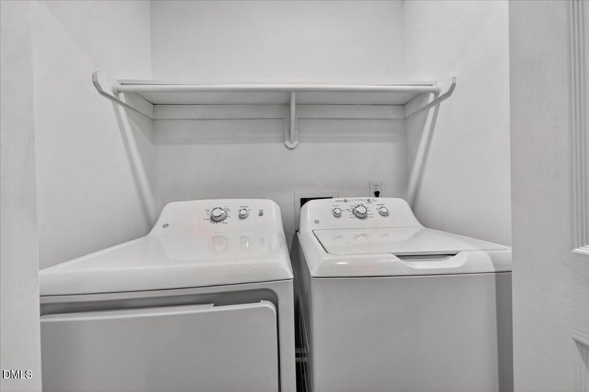 503 Gooseneck Drive, Unit A1 Cary, NC 27513 - Photo 21 of 37 a utility room with dryer and washer