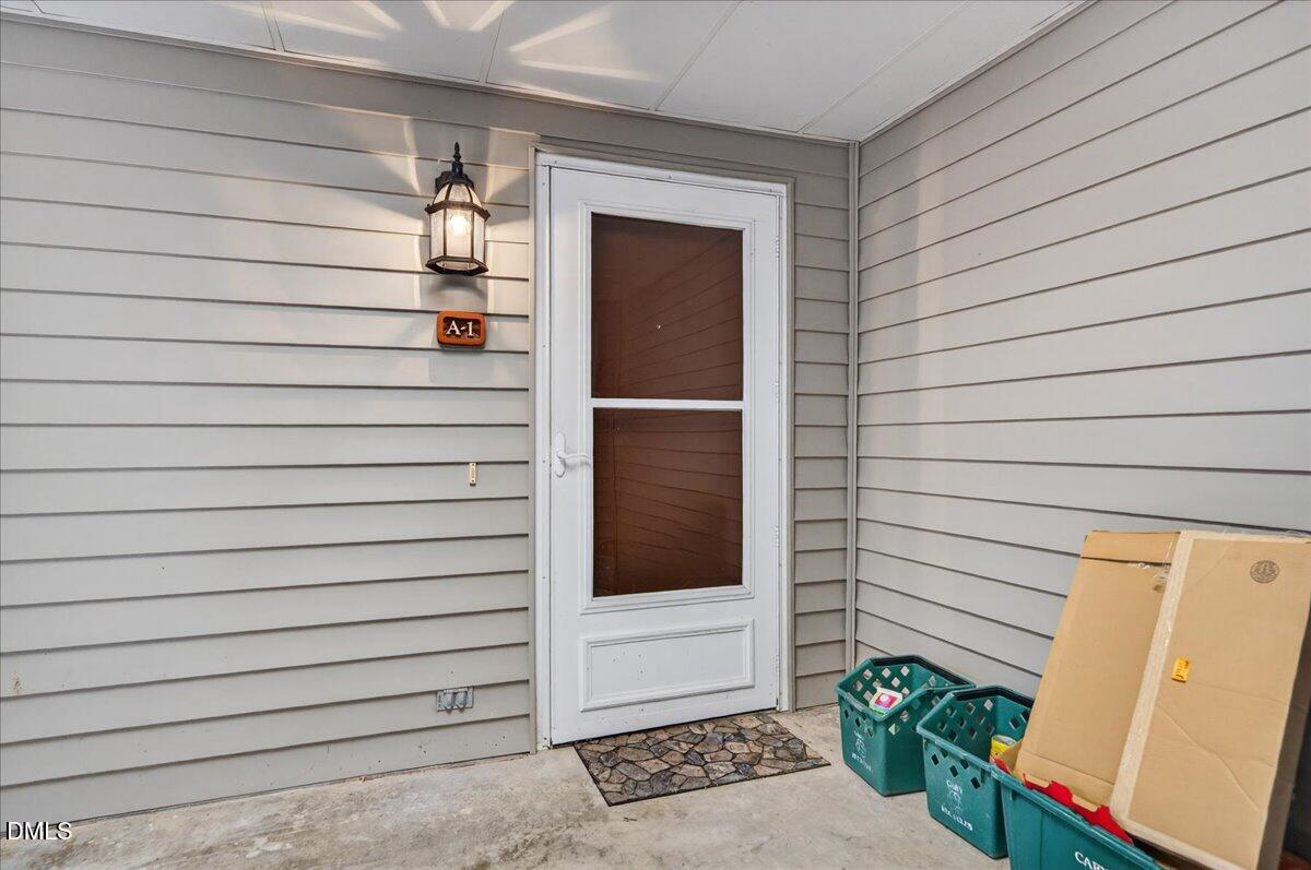 503 Gooseneck Drive, Unit A1 Cary, NC 27513 - Photo 22 of 37 a view of front door and bedroom