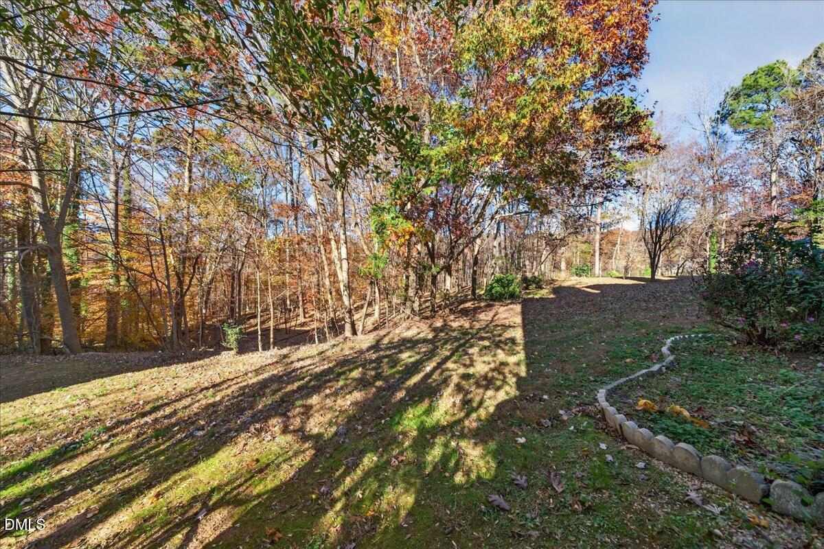 503 Gooseneck Drive, Unit A1 Cary, NC 27513 - Photo 26 of 37 a view of a yard with trees