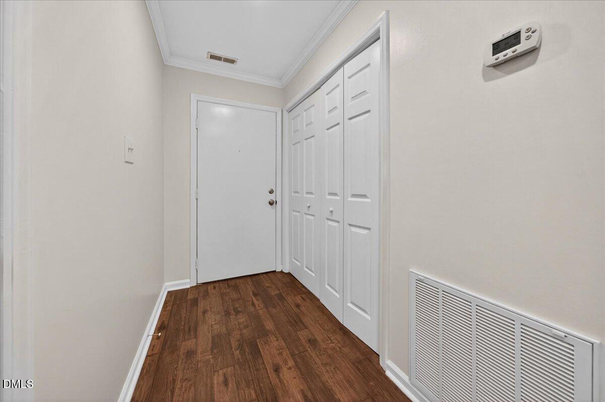 503 Gooseneck Drive, Unit A1 Cary, NC 27513 - Photo 3 of 37 a view of a hallway with wooden floor