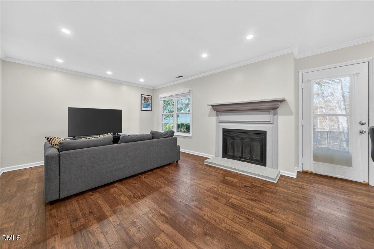 503 Gooseneck Drive, Unit A1 Cary, NC 27513 - Photo 4 of 37 a living room with furniture and a fireplace