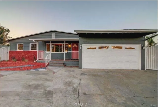 a view of a street with cars parked on road