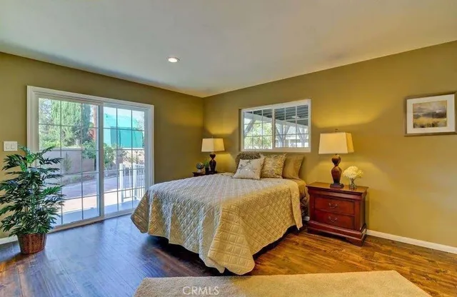 a bedroom with a bed and a lamp