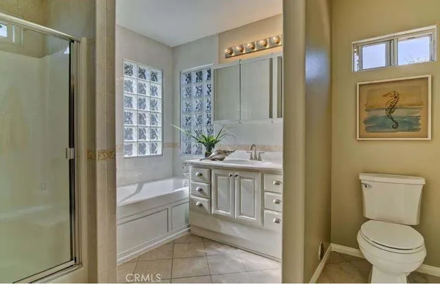 a bathroom with a sink a vanity and a mirror