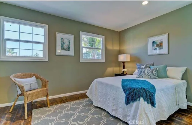 a utility room with dryer washer and a view of living room