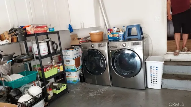 a view of a patio with table and chairs