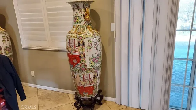 a kitchen with sink a window and cabinets