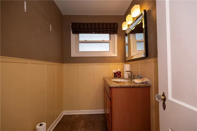 a bathroom with a sink and a window
