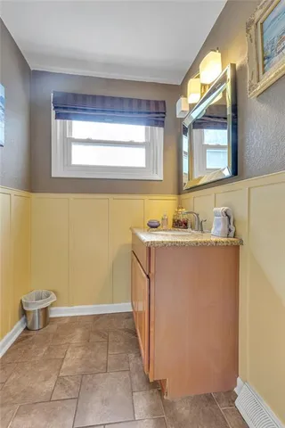 a bathroom with a sink a vanity and a mirror