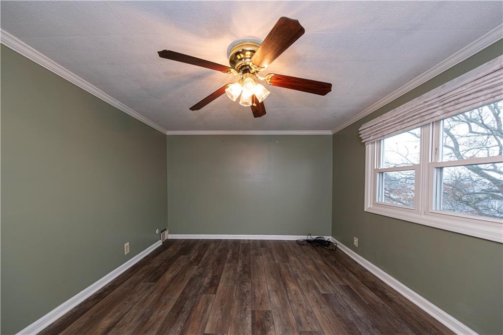 979 Seventh Street Beaver, PA 15009 - Photo 25 of 47 a view of a room with wooden floor and windows