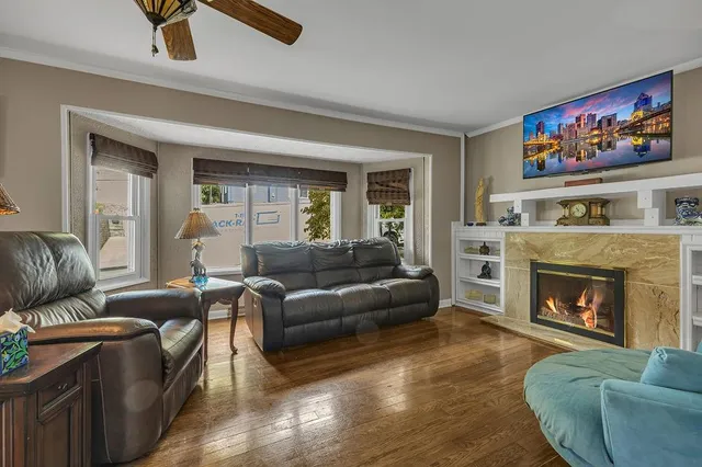 a living room with furniture and a fireplace
