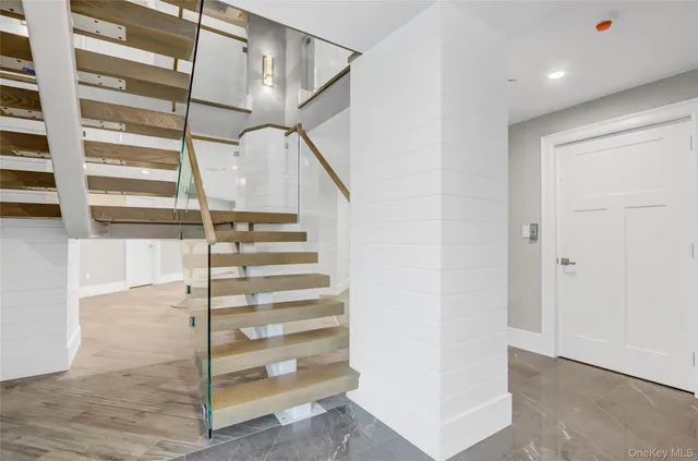 a bathroom with a shower and a sink