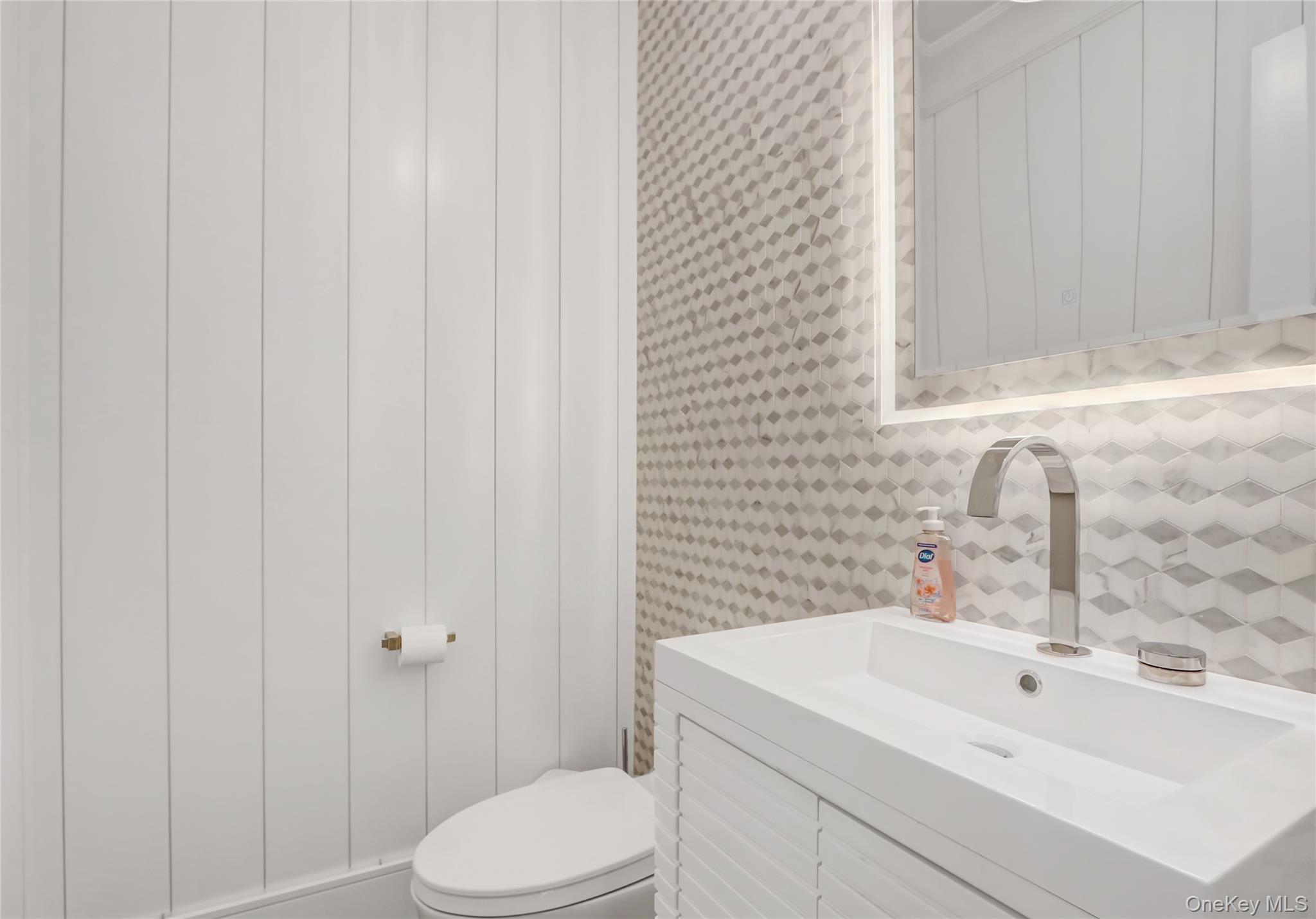 44 Bayside Drive Point Lookout, NY 11569 - Photo 33 of 47 a bathroom with a sink a toilet and shower