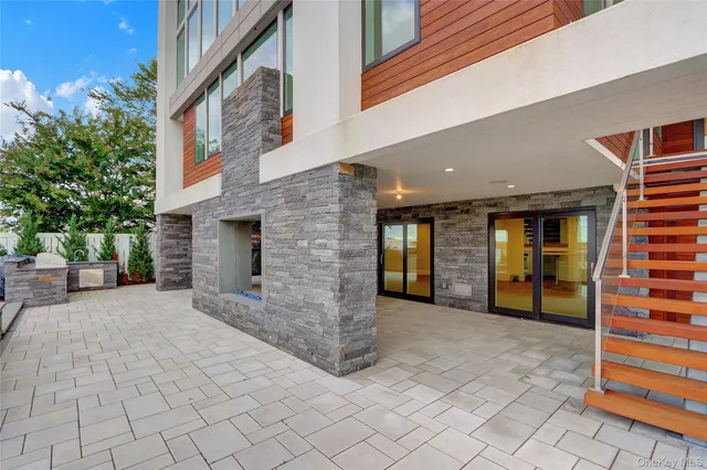 a terrace with a table and chairs
