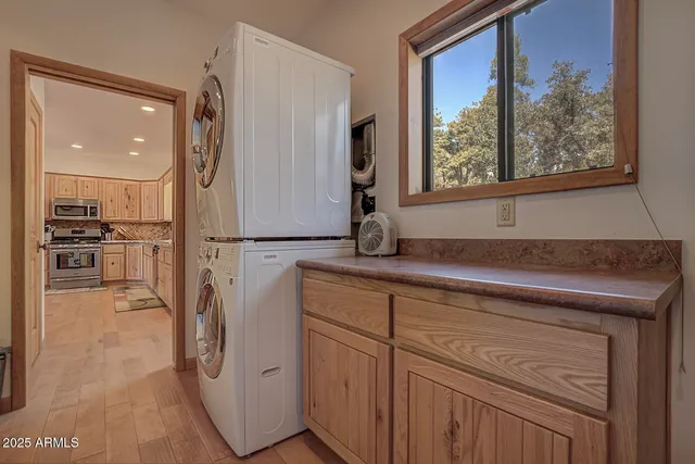 a bedroom with bed and a chandelier