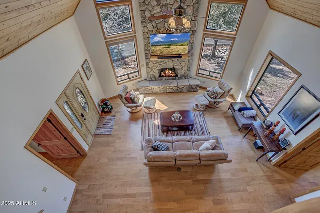 a bedroom with furniture and a large window