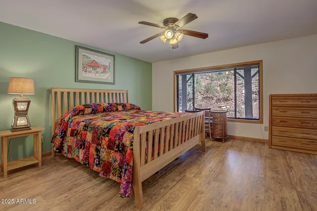 an aerial view of a house with yard and sitting space