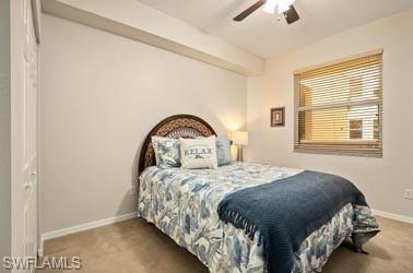 450 Launch Circle, Unit 203 Naples, FL 34108 - Photo 11 of 23 a bedroom with a bed and a window