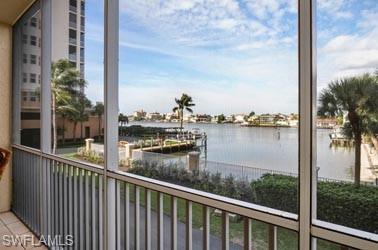 450 Launch Circle, Unit 203 Naples, FL 34108 - Photo 13 of 23 a view of a lake from a balcony