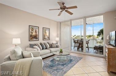 450 Launch Circle, Unit 203 Naples, FL 34108 - Photo 2 of 23 a living room with furniture and a view of kitchen