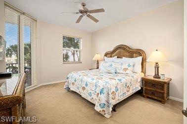 450 Launch Circle, Unit 203 Naples, FL 34108 - Photo 8 of 23 a bedroom with a bed and a window