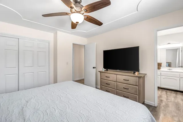 a bathroom with a sink toilet vanity and mirror