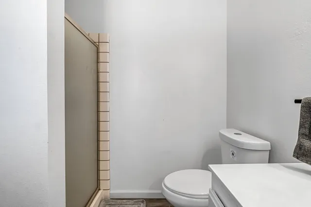 a swimming pool with an outdoor space and seating area