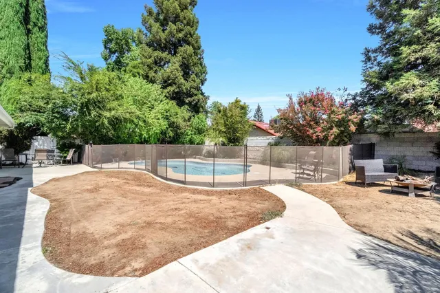 a view of a backyard with a patio